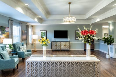 Bright and welcoming common area with floral arrangements