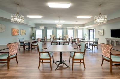 Bright common area with tables and chairs