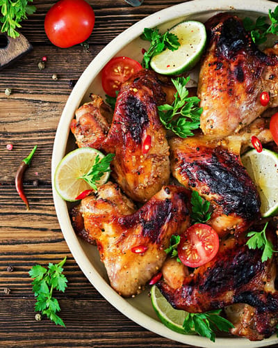 Deliciously arranged grilled chicken with herbs and spices