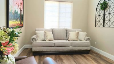 Cozy seating area with a sofa and floral decor