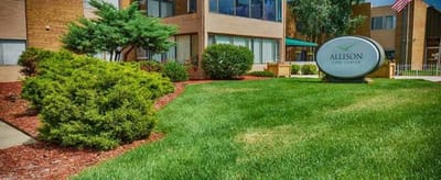 Exterior view of Allusion Care Center with landscaped garden