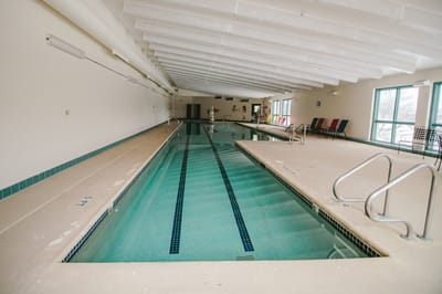 Indoor swimming pool area with lane markings