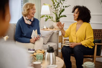 Whispering Chase | Sky Active Living, independent living in Cheyenne, WY — Two women engaging in conversation in a cozy living room
