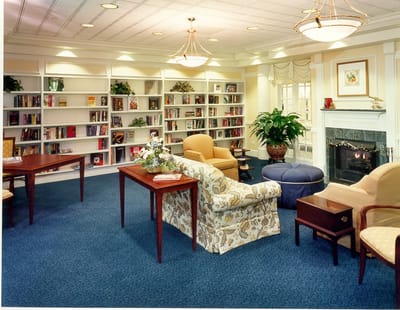 Interior common area with bookshelves and seating