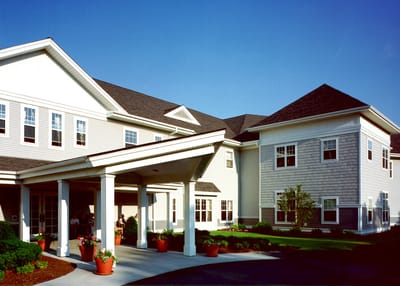 Exterior view of a senior care facility with entrance