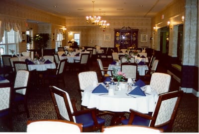 Elegant dining room setup with tables and decorations