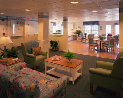 Bright common area with seating and dining spaces