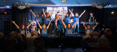 Residents enjoying a performance during a lively event