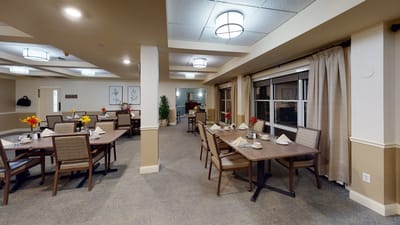 Dining area set with flowers and table settings