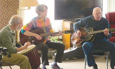 Residents engaging in a music activity in a common area