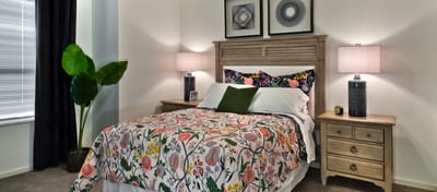 Cozy private bedroom with colorful bedding and decor