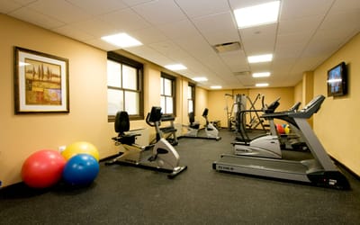 Well-equipped fitness room with exercise machines.