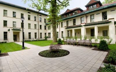 Courtyard with benches and well-manicured lawn