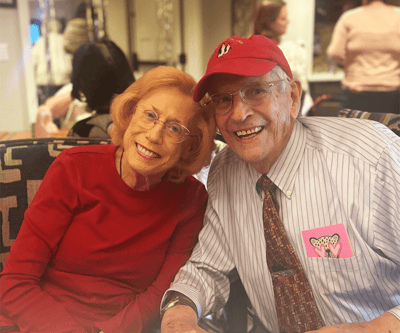 Two smiling residents enjoying a social activity