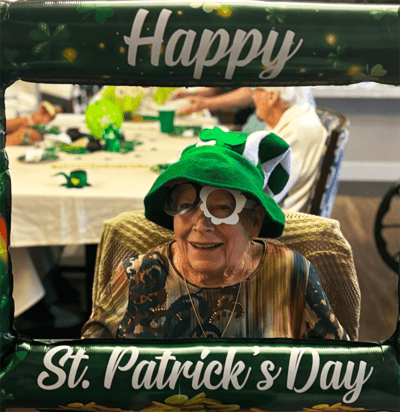 Resident celebrating St. Patrick's Day with decorations