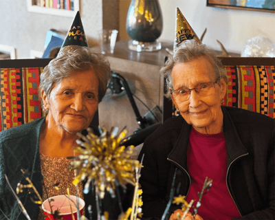 Two residents celebrating New Year's in a common area