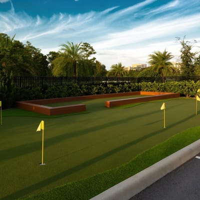 Outdoor putting green with palm trees