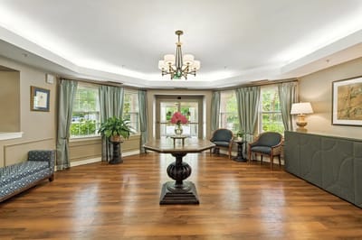 Interior view of a common area with seating and plants