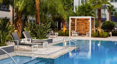 Outdoor swimming pool area with lounge chairs