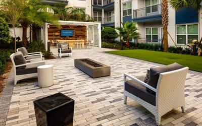 Outdoor seating area with modern furniture and landscaping