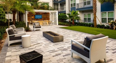Outdoor lounge area with seating and landscaping
