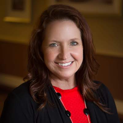 Portrait of a smiling staff member in a facility