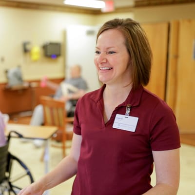 Staff member interacting with residents in common area