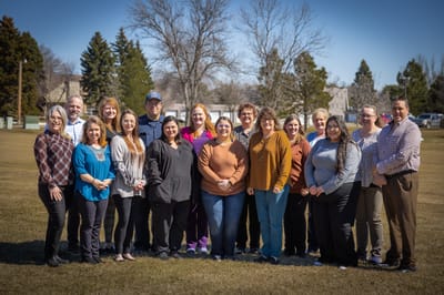 Staff members gathered in an outdoor space