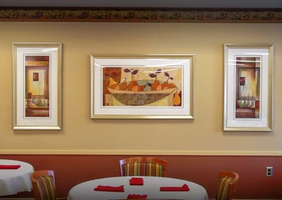 Artwork displayed on a dining room wall