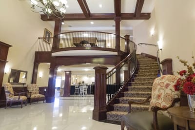 Interior view of a welcoming lobby with a staircase