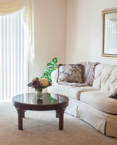 Cozy lounge area with a couch and decorative table
