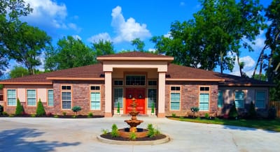Exterior view of a senior care facility with landscaping