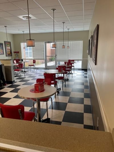 Dining area with red chairs and tables
