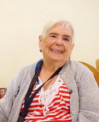 Smiling resident in a cozy common area