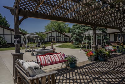 Outdoor seating area with flowers and shade structures