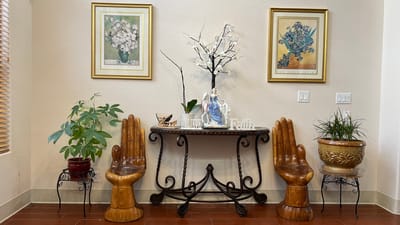 Decorative interior space with artwork and plants