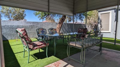 Outdoor seating area with metal chairs and table