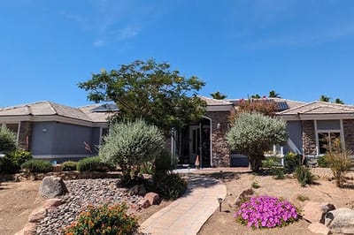 Exterior view of Mother’s Touch Senior Home with landscaping