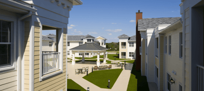 Outdoor seating area with gazebo and landscaped grounds