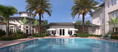 Outdoor pool area with palm trees and seating