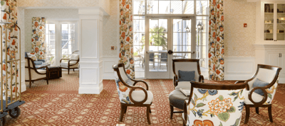 Bright common area with floral decor and seating
