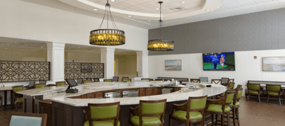 Modern dining area with a curved bar and seating