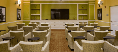Interior seating area with chairs and a television
