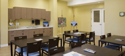 Bright interior room with tables and art supplies
