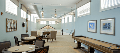 Bright interior common area with tables and chairs