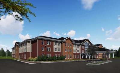 Exterior view of a senior living facility with landscaping