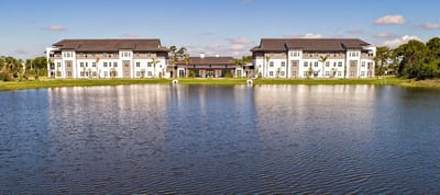 Exterior view of Watercrest St. Lucie West by a lake