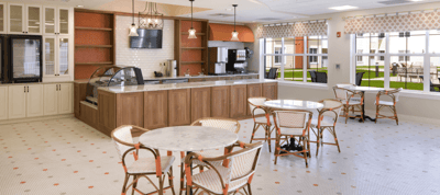 Bright common area with seating and cafe counter
