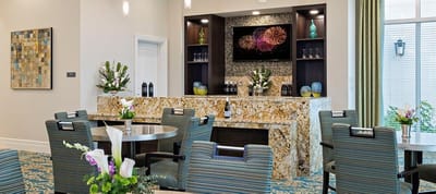 Bright common area with tables and décor