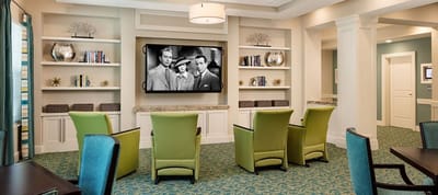 Bright lounge area with seating and television